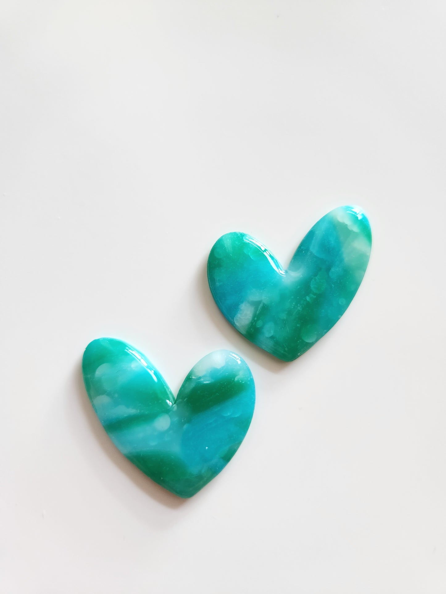 Corazón translúcido verde azul
