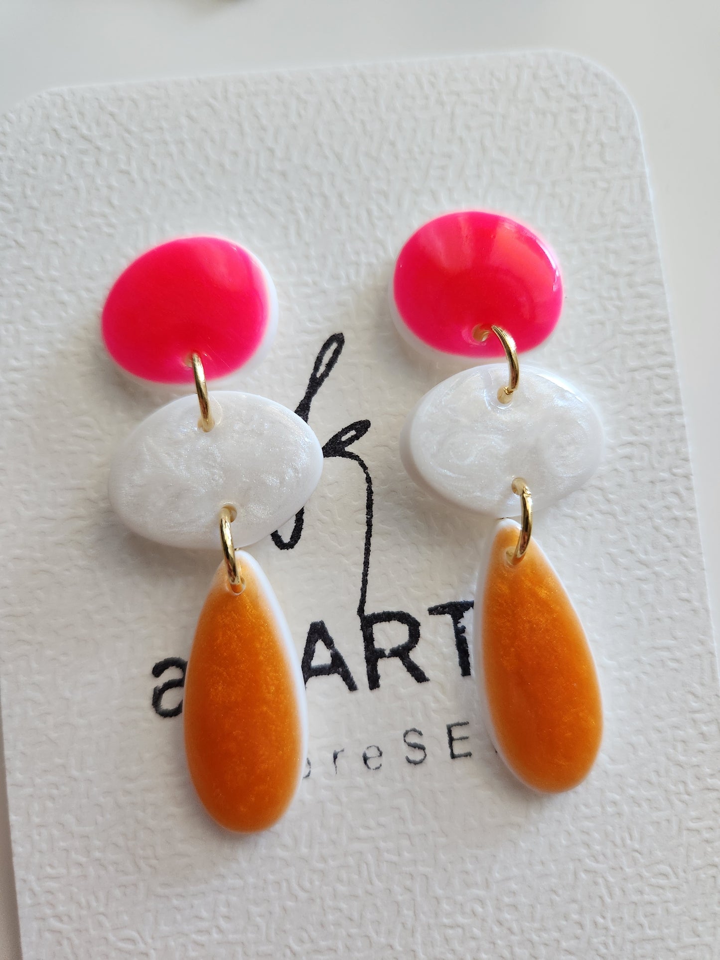 Aros Marea fucsia, blanco y naranjo