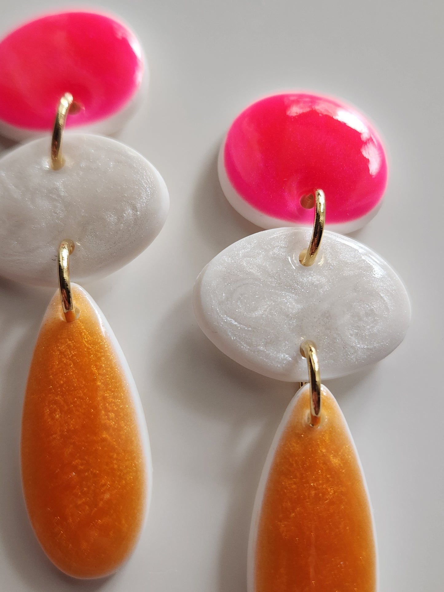 Aros Marea fucsia, blanco y naranjo